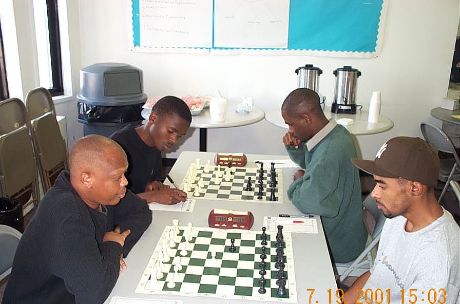 Kobese vs. Solomon (foreground); Simutowe vs. Nsubuga (background). Copyright , Daaim Shabazz.