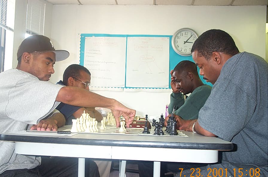 The main event. . . Solomon vs. Morrison (foreground). FM Morrison playing for the IM title. FM Muhammad plays Nsubuga in background. Copyright , Daaim Shabazz.