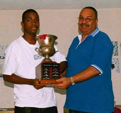 Brandon Wilson accepting Presidents Cup from former JCF President, Frederick Cameron.