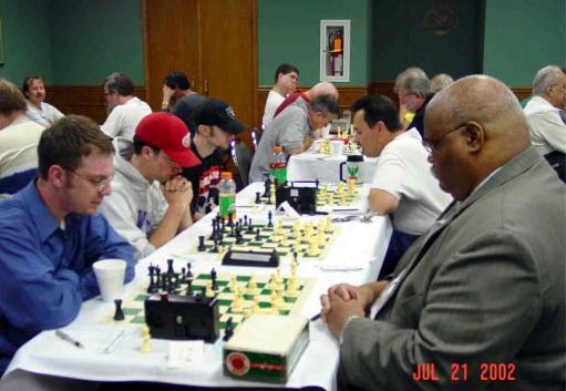 Cedric Thompson (on right) playing Josiah Stein at the Green Bay Open. Copyright  The Chessmill, 2002.