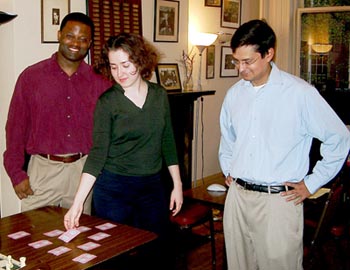 IM Irina Krush, as the only woman in the tournament, was 
accorded the duty of choosing the first pairing number. She chose an ace and was assigned No. 1. At left is GM Maurice Ashley, CEO of Generation Chess; at right is Andres Soto member of the Board of Directors of Generation Chess. Photo by Jerry Bibuld.