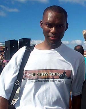 Im wearing one of the shirts at the 2001 Grand Opening of the Hall of Fame Chess Museum in Miami, Florida. It was hot that day! 