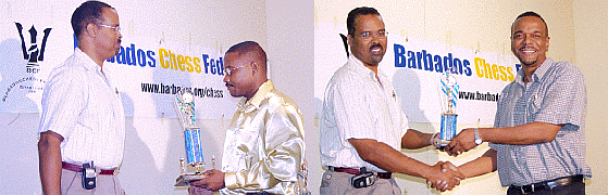 FMs Delisle Warner and Dr. Philip Corbin accepting their National Championship awards from a representative of Royal Bank of Canada. Photo by Barbados Chess Federation.