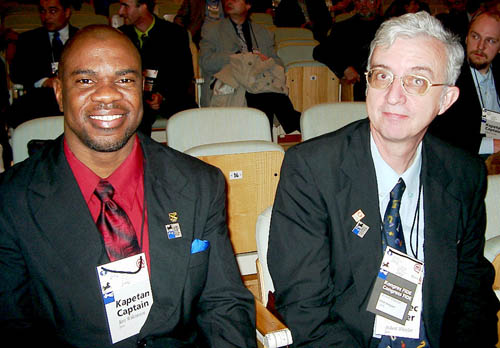 Jamaican Federation President Ian Wilkinson with NM Robert Wheeler at the opening ceremonies at the 2002 Olympiad in Bled, Slovenia. Copyright  2002, Jerry Bibuld.