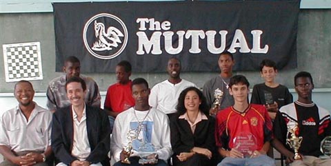 Allan Munro (TRI) vs. Justin Kirton (BAR) in a crucial  7th round match. Copyright © 2002, Barbados Chess Federation.