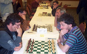 GM Row: (bottom-top) Yermolinsky-Kaidanov, Ehlvest-Wojtkiewicz, Shulman-Novikov (waiting). Copyright © 2003, Daaim Shabazz