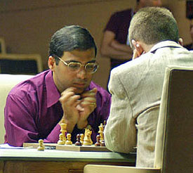 Anand-Adams in action. Adams seems to be plugging his ears from all the fireworks exploding around his king. 