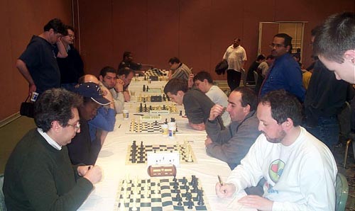 The Short Schedule: GMs Igor Novikov and Ilya Smirin have already agreed a quick draw while IM Amon SimutoweGM Alexander Goldin have just begun. Copyright  Daaim Shabazz, 2003.