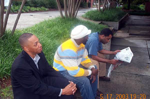 (L-R) Frank Johnson, Negash Bezaleel, Isaac Hinch relax in between rounds. Copyright © 2003, Daaim Shabazz