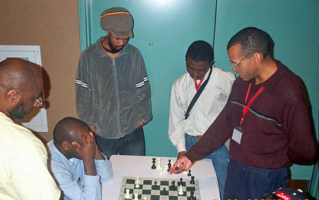 Muhammad showing his game to IM Oladapo Adu.