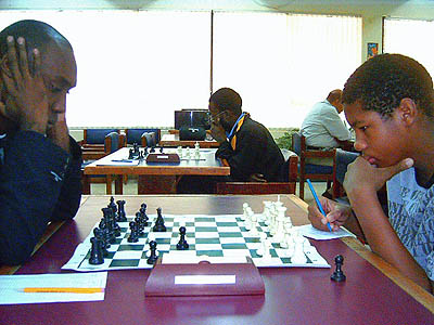 Tournament leader FIDE Master Warren Elliott, during his first round game against his student Stuart James.