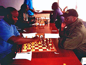 Ateka left and Makatia right in a tension packed game. Copyright  Alex Makatia, 2005.