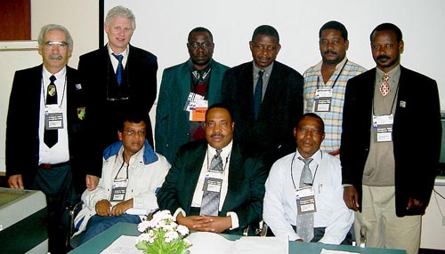 Representatives of Zone 4.3 pose after the African Continental Meeting. Seated in the center is Lewis Ncube, incoming Zonal President. Copyright  Jerry Bibuld, 2002.