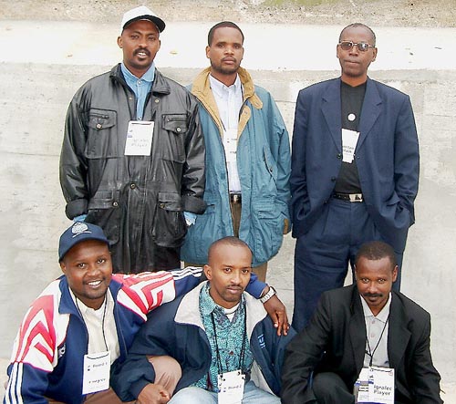 Rwanda's Men’s Team (kneeling, left to right) Fidele Mutabazi (Bd. 1), Maxence Murara (Bd. 2) and Johnson Rutayisire (Bd. 3); standing (left to right) Rugema Ngarambe (Bd. 4), Chrisotpher Karenzi (Bd. 5) and Edison Niyongereye (Bd. 6 and Captain). Copyright © Jerry Bibuld, 2002.