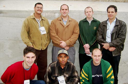 South Africa's Men’s Team (kneeling, left to right) IM David Gluckman (Bd. 1), FM Kenny Solomon (Bd. 2) and Jonathan Gluckman; standing (left to right) Captain Lyndon Bouah, Mark Levitt (Bd. 4), Yuri Aronov (Bd. 5) and Ewen Kromhout (Bd. 6). Copyright © Jerry Bibuld, 2002.