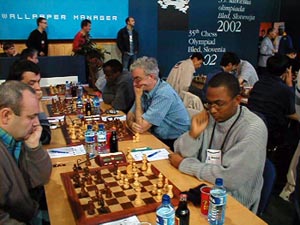 Jamaican Men in Round #1.
(top L-R) FM Warren Elliott, Duane Rowe, Robert Wheeler, Mark Smith. Copyright  Barbados Chess Federation, 2002.