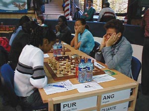 Puerto Rico vs. Angola (Women). Copyright  Barbados Chess Federation, 2002.