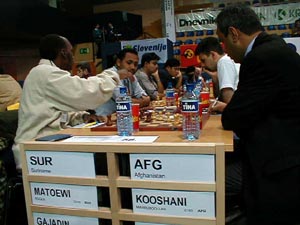 Suriname vs. Afghanistan (Men). Copyright  Barbados Chess Federation, 2002.