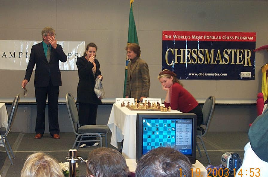 Multiple Expressions… IM Irina Krush (eating apple) beats a dejected WIM Jennifer Shahade. Copyright © 2003, Daaim Shabazz.