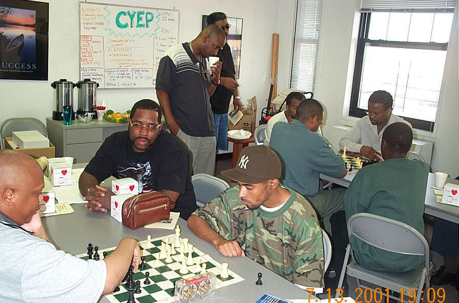 South Africans Kobese and Solomon square off while Muhammad and Ashley lock horns in an intense blitz session. Copyright ©, Daaim Shabazz.