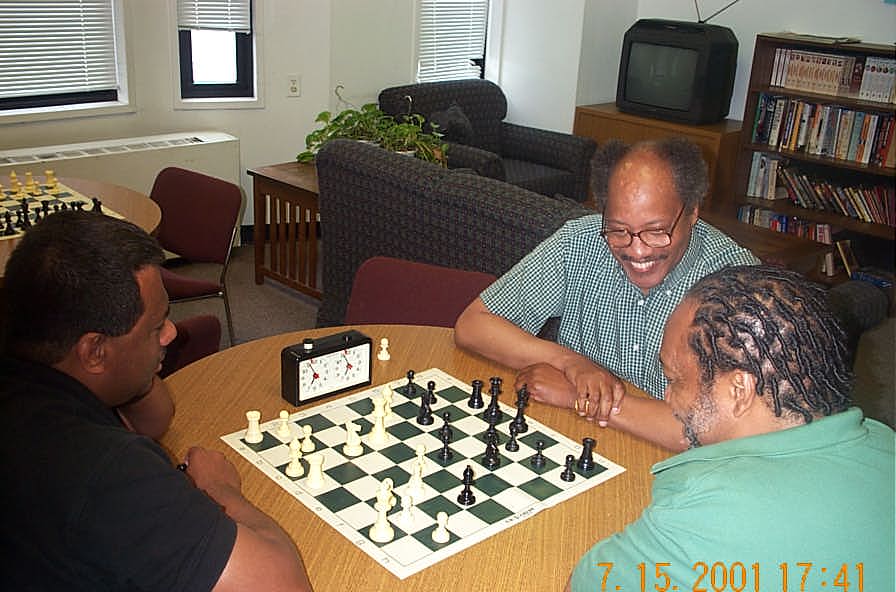 FM Ron Simpson takes on the legendary NM Frank Street as Willie 'Pop' Johnson looks on. Copyright ©, Daaim Shabazz.