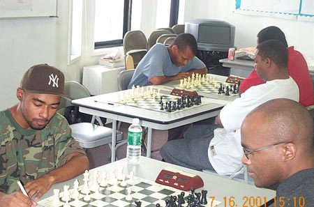 GM Sergey Kudrin vs. FM Stephen Muhammad. Copyright  2003, Jerry Bibuld.