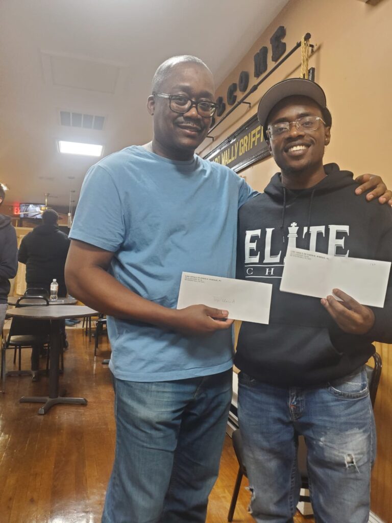 Clotaire Colas with nephew Josh Colas holding their prizes. Photos and videos courtesy of Aggrey Duncan