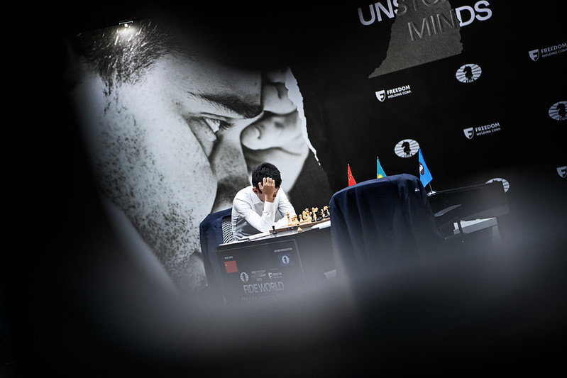 Ding Liren embroiled in thought, but which thoughts?
Photo by Stev Bonhage
