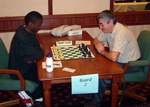 IM Amon Simutowe is pictured (left) with IM Rade Milovanovic in the recent Texas Class Championship. Milovanovic helped Simutowe prepare for the African Championships. (Photo by Texas Chess Association)