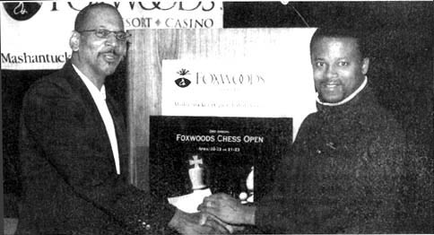 Donald Colbert (left) congratulating  GM Maurice Ashley after his 2000 Foxwoods tournament win. GM Ashley would successfully defend his title in 2001. Copyright © 2000, Jerry Bibuld.