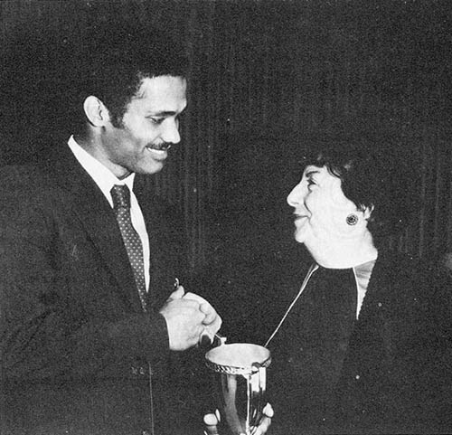 Air Force Sergeant Emory A. Tate, Jr., stationed at Ft. Meade, Maryland accepts the first annual Haskell Small Award for taking individual honors at the 25th Annual Armed Forces Chess Championship Tournament Tate won the tournament, which was held in Washington, D.C. from September 11-20 (1984), with a score of 8½-3½.