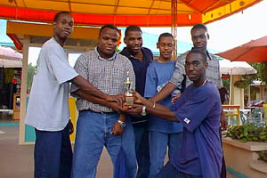  Jamaican Youth Team after beating the Jamaican Senior Team 6½-5½!! (L-R) Equitable Brown, NM Duane Rowe, NM Jomo Pitterson, Alain Morais, O’Neil Myers, and NM Warren Elliott. Copyright © 2001, Jamaican Ambassadors Academy.