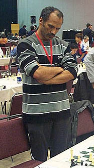 Emory Tate ponders move at Maurice Ashleys HB Global Chess Challenge in 2006. Photo by Daaim Shabazz.