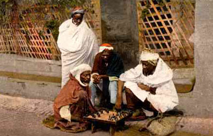 A Moor and a Christian playing chess in a tent, from the 'Book of Games, Chess, dice and Boards