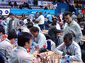 Mauritus vs. Brunei at the 2002 Chess Olympiad in Bled, Slovenia. Board #1 player Roy Phillips is observing the games.