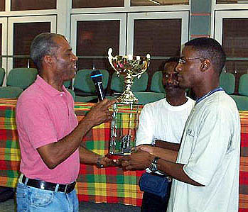 Gilles Suez-Panama receiving his championship trophy at Martiniques 2002 Pavilla Memorial. Photo by Ligue dEchecs de la Martinique.