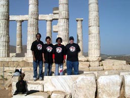 Fritz Gaspard (coach), Luz Parrilla (mother), Medina Parrilla, IM Yury Lapshun (coach) at the Coliseum at Poseidon.