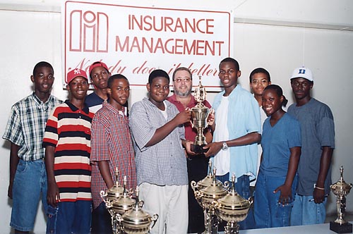 Pictured L-R: Senior Division Co-Champions from C. R. Walker High: Charles Ashe, Walter Rolle, Garnel Leo, Debaro Hughes, Elton Joseph; Insurance Management's Brain Evans. Temple Christian's Chadbourne Rolle, Naveen Ferguson, Nadia Smith and Ladario Brown.