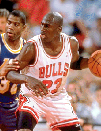 Michael Jordan being checked by 'Magic' Johnson.