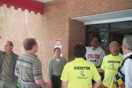 Peter Moss (Syracuse shirt) accusing Aleksander Vayserberg (striped shirt) of cheating. Yevginy Vayserberg at far left.