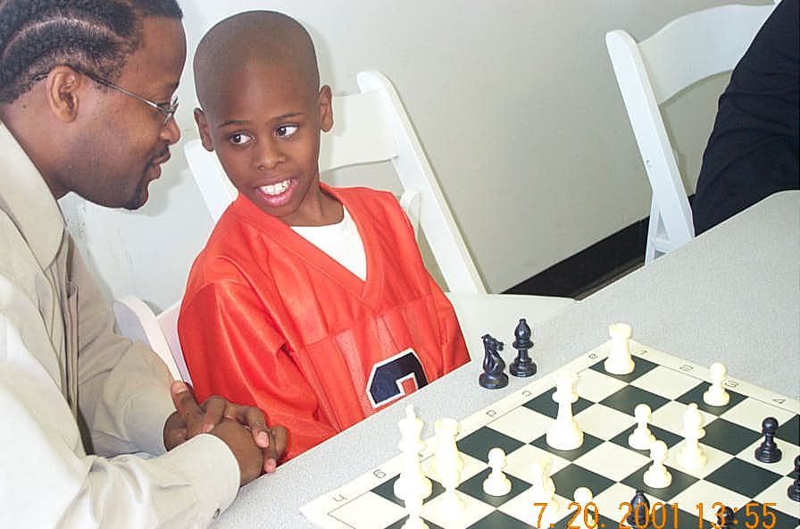 GM Maurice Ashley with enthusiastic pupil, Tevin White. Copyright © 2001, Daaim Shabazz.