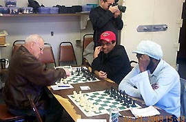 Negash Bezaleel waits on FM Todd Andrews arrival while Kazim Gulamali (red cap) battles NM Klaus Pohl.