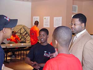 GM Maurice Ashley gives an encouraging word to budding chess players in Oakland, California.