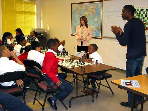 GM Polgar addresses students at St. Phillips School as IM Simutowe encourages his  students.