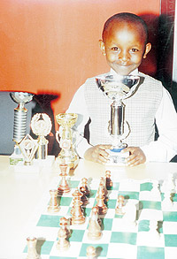 Peniel Weru displays trophies he has won in recent days.