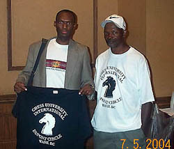 James Taylor (right) present The Chess Drums Daaim Shabazz with Chess University t-shirt.