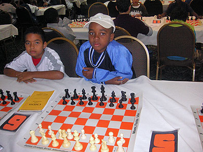 Joshua Blanchard of Barbados teams with RJ Nelson in a “bughouse” tournament. It was RJ’s first time playing the variant and enjoyed it tremendously say his aunt, Lesley-ann Nelson.