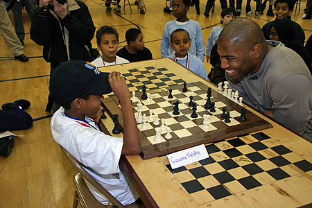 Eight-year old Gerume Malaku (left) joisting a bit with Shaun Alexander of the Seattle Seahawks. Alexander won.