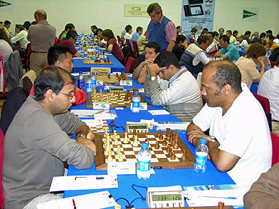 IM Emory Tate (right) takes on Morocco's  GM Hichem Hamdouchi at Calvia Chess Festival. Hamdouchi won in 66 moves. Photo from calviafestival.com.