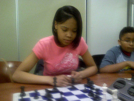 Medina Mathis, a junior at Cass Tech High School at a Detroit Chess Club blitzing.  Photo by Kevin Fite.